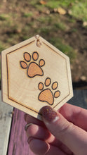 Load and play video in Gallery viewer, Orange Gold Paw Print Ornament