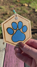 Load and play video in Gallery viewer, Bright Blue Paw Print Ornament