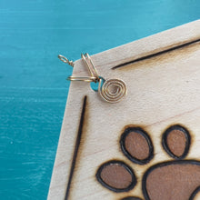Load image into Gallery viewer, Orange Gold Paw Print Ornament