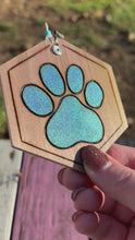 Load and play video in Gallery viewer, Sparkly Blue Paw Print Ornament
