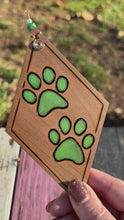 Load and play video in Gallery viewer, Green Paw Prints Ornament
